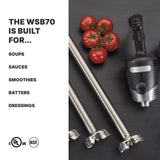 On a dark surface, a Heavy Duty immersion blender with a detachable 21" stainless steel shaft is next to a vine of five tomatoes. Text reads: “The WSB70 is built for… Soups, sauces, smoothies, batters, dressings.” UL and NSF certification symbols appear below.