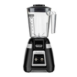 A black Waring Commercial Bar Blender with a clear, lidded 1.4 liter copolyester container marked with measurement lines stands upright. The front base displays the Waring logo, “BLADE,” and two toggle switches labeled “OFF/ON” and “PULSE.”.
