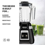 A Waring Commercial BB300 Blade Bar Blender is shown on a counter beside two glasses of green smoothies with leafy greens. Text on the left reads: THE BB300 2-speed, 48-oz. plastic container IS BUILT FOR... BLENDED COCKTAILS, MOCKTAILS, SMOOTHIES. NSF and safety icons are at the bottom.