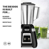 A Blade Bar Blender with a stainless steel container sits on a countertop beside two glasses of green smoothie. Text on the left reads: “THE BB300S IS BUILT FOR... BLENDED COCKTAILS, MOCKTAILS, SMOOTHIES.” Certification icons are at the bottom.