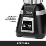 Close-up of a black Waring Commercial Bar Blender base with a toggle switch for “HIGH,” “LOW,” and “OFF,” plus a pulse button. Text reads: “1 HP MOTOR WITH 2-SPEED TOGGLE SWITCH + PULSE.” The word “FEATURES” appears at the bottom.