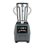 A commercial-grade Waring Commercial Blender with a 4 liter stainless steel container, two sturdy side handles, and a clear lid. Its black base features labeled buttons and a digital display, with CB15 The Legend written prominently on the front.
