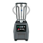A commercial-grade Waring Commercial Blender with a 4 liter stainless steel container, two sturdy side handles, and a clear lid. Its black base features labeled buttons and a digital display, with CB15 The Legend written prominently on the front.