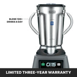 A Waring CB15 commercial blender with two side handles sits on a black base displaying “CB15 THE LEGEND.” Text reads “BLEND 100+ DRINKS A DAY.” A banner below states: “LIMITED THREE-YEAR WARRANTY.”.