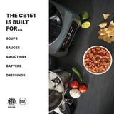 A heavy-duty food blender with a stainless steel container sits on a dark countertop beside salsa, tomatoes, peppers, lime, tortilla chips, and its lid. Text reads: “THE CB15T IS BUILT FOR... SOUPS, SAUCES, SMOOTHIES, BATTERS, DRESSINGS.” Certification logos below.