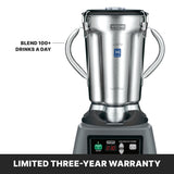 A commercial Waring Food Blender with a heavy-duty stainless steel container is shown. Text reads “BLEND 100+ DRINKS A DAY.” Below the blender, a banner states “LIMITED THREE-YEAR WARRANTY.” The control panel displays buttons and a digital timer.