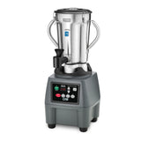 A commercial-grade, heavy-duty food blender with a stainless steel container, side handles, and a black lid sits atop a gray square base featuring a digital display, buttons, and the brand name “CBLS.” The base has rounded edges and black feet for stability.