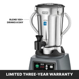 A stainless steel Waring Commercial blender with a digital display and spout is shown. Designed for international use, it’s sturdy and professional. Text reads “BLEND 100+ DRINKS A DAY.” A black banner says, “LIMITED THREE-YEAR WARRANTY.”.
