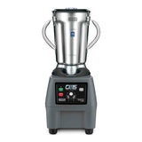 A commercial blender with a metal base, digital control panel, and two side handles. It features a large stainless steel container, clear lid, and front buttons and dial marked CB15 and Waring Commercial for precise variable speed control.