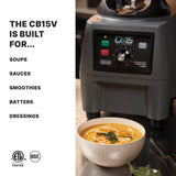 A powerful commercial blender with variable speed control labeled CB15 sits on a kitchen counter behind a bowl of creamy soup, garnished with herbs and seeds. Text on the left lists uses: soups, sauces, smoothies, batters, dressings. Certification logos are at the bottom.