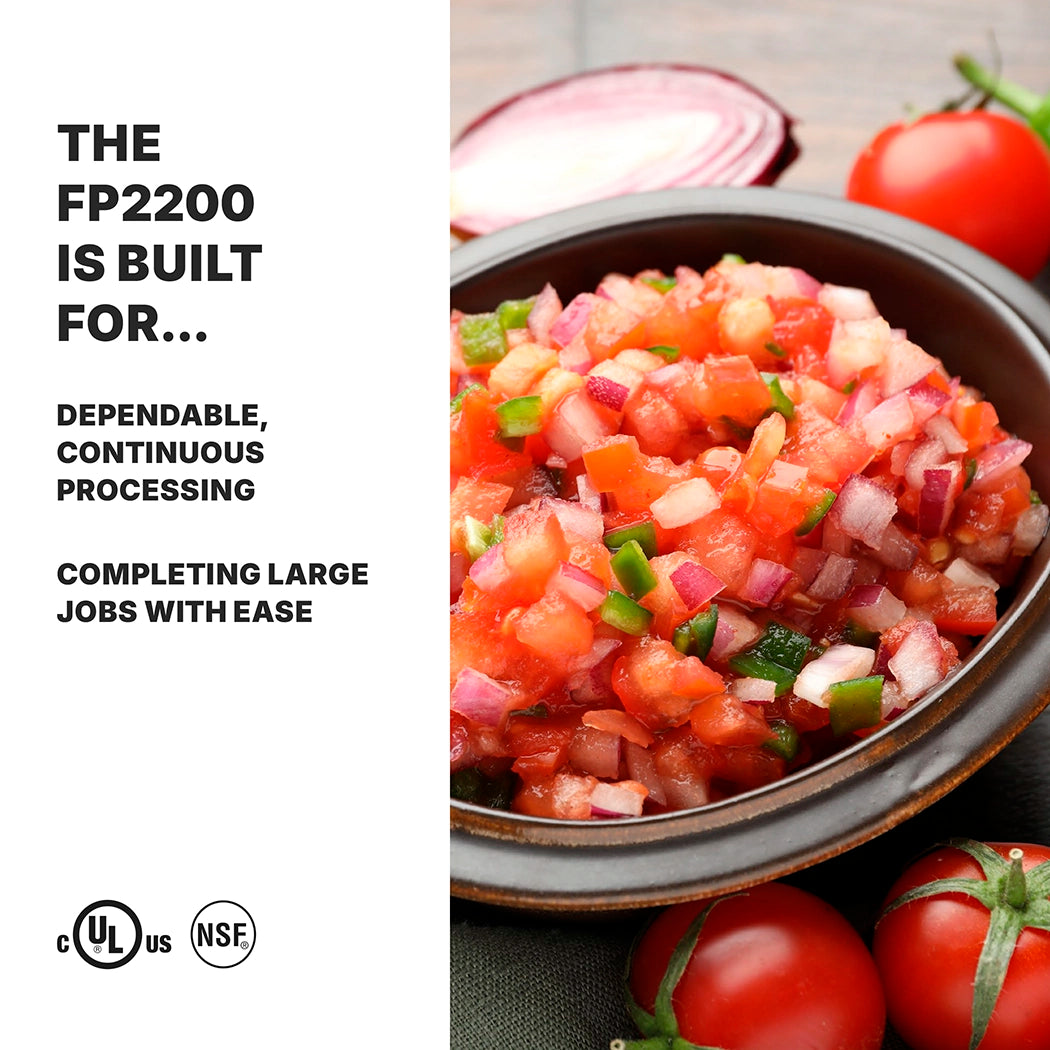 A bowl of fresh salsa with diced tomatoes, onions, and jalapeños sits on a wooden surface beside whole tomatoes and a sliced red onion. Bold text reads: “The FP2200 Waring food processor features a 3/4-HP motor for dependable, continuous feed.”.