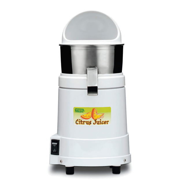 A white electric citrus juicer with a stainless steel juice collector bowl, a clear dome lid, and spout. The front displays a “Citrus Juicer” sticker with sliced fruit. It has an on/off switch and stands firmly on four black feet.