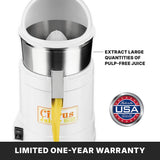 A white heavy duty electric citrus juicer dispenses yellow juice from its spout. Text reads EXTRACT LARGE QUANTITIES OF PULP-FREE JUICE. A USA seal, LIMITED ONE-YEAR WARRANTY, power switch, and Citrus Juicer label are on the front.