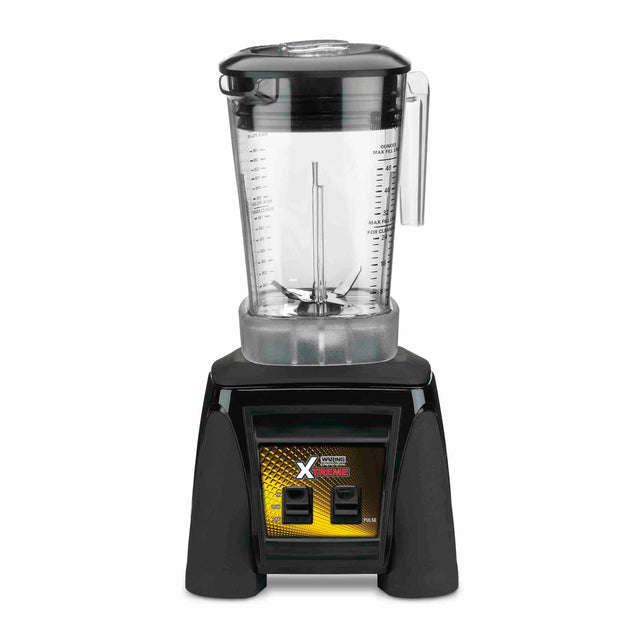 A countertop Xtreme Series Blender with a clear plastic pitcher and handle, black lid, and black base. The base features two switches and a yellow Xtreme label, with measurement markings visible on the pitcher—designed for international use.