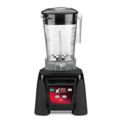 An Xtreme Series Blender with a clear plastic pitcher, measurement markings, handle, and lid sits atop a black base featuring a digital control panel and display—designed for international use and compatible with a sound enclosure for quieter blending.
