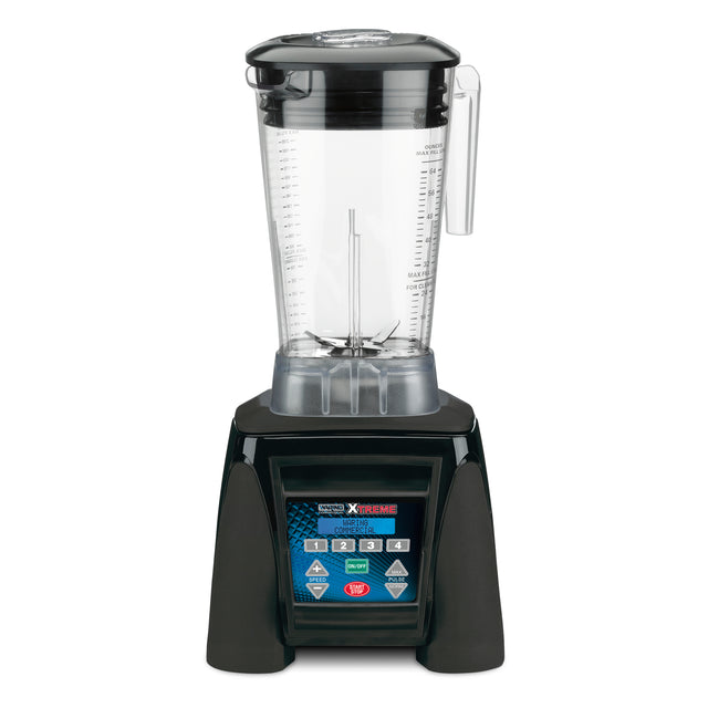 A high-power commercial blender with a clear, 64 oz pitcher, sturdy handle, and lid sits atop a black base. The base features a blue digital control panel with multiple buttons, symbols, and a small screen for versatile blending settings.