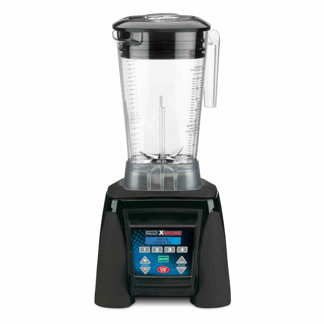 A high-powered Xtreme Series Blender with a large clear pitcher, black base, and digital control panel displaying various buttons and settings. The lid is black with a clear center cap, and measurement markings are visible on the pitcher.
