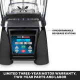 Close-up of a commercial blender base with a digital control panel featuring labeled speed, pulse, and start/stop buttons. Image text highlights 4 programmable beverage stations and a limited three-year motor warranty, two-year parts and labor.
