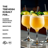 Three frosty, pale orange frozen cocktails garnished with lime and mint sprigs sit on a bar counter. On the left, bold text reads: “The heavy duty TBB145S4 bar blender with stainless steel container is built for blended cocktails, smoothies, and more.”.