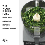 A food processor bowl filled with chopped green herbs sits on a Waring commercial base. The Pro Prep Chopper Grinder boasts 3/4 quart capacity, ideal for international use. Left text reads: THE WCG75 IS BUILT FOR… WHOLE SPICES, HARD FOODS, PREP JOBS, FINISHING TOUCHES. UL icons below.