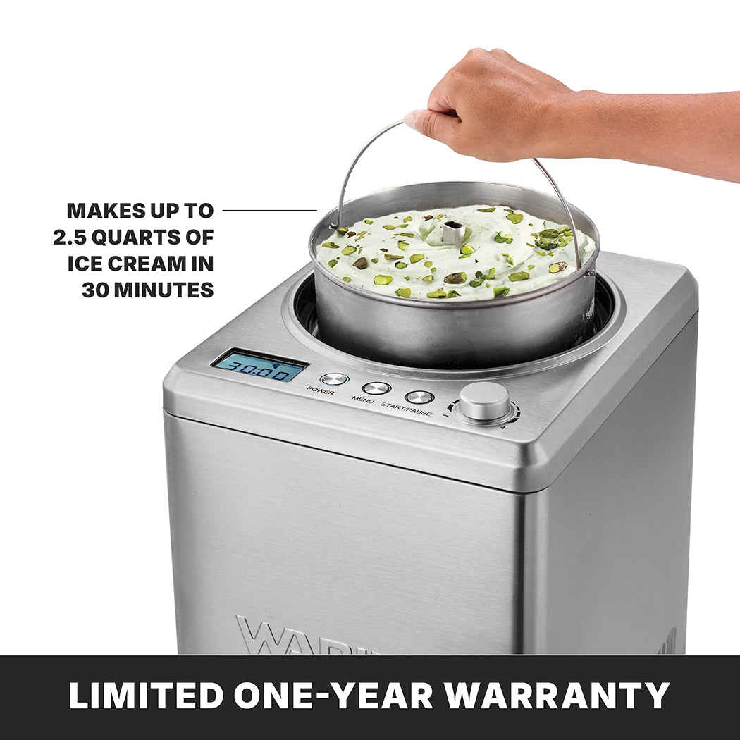 A hand lifts a bowl of pistachio ice cream from an Ice Cream Maker with a digital display and built-in compressor. Text reads, Makes up to 2.5 qt. of ice cream in 30 minutes. A banner at the bottom states, LIMITED ONE-YEAR WARRANTY.