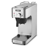 A stainless steel Waring commercial coffee maker with a modern, café deco-inspired rectangular design. It features indicator lights, a brew button, black filter holder, large cup space below the dispenser, and the Waring logo on the front.