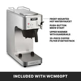 A stainless steel commercial coffee maker designed for café deco settings, with labeled features: front-mounted hot water faucet, push-button brew start, upper warmer with guardrails, and a 25-piece coffee filter starter pack. INCLUDED WITH WCM60PT.