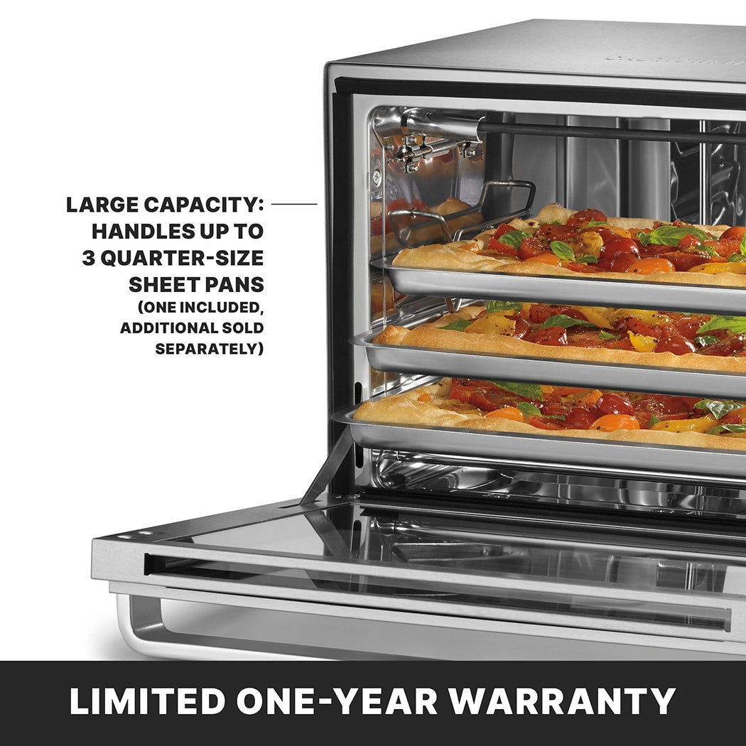 A commercial convection oven with a stainless steel finish sits open, revealing three racks and rectangular pizzas inside. Large capacity: handles up to 3 quarter-size sheet pans (one included, additional sold separately). Limited one-year warranty.