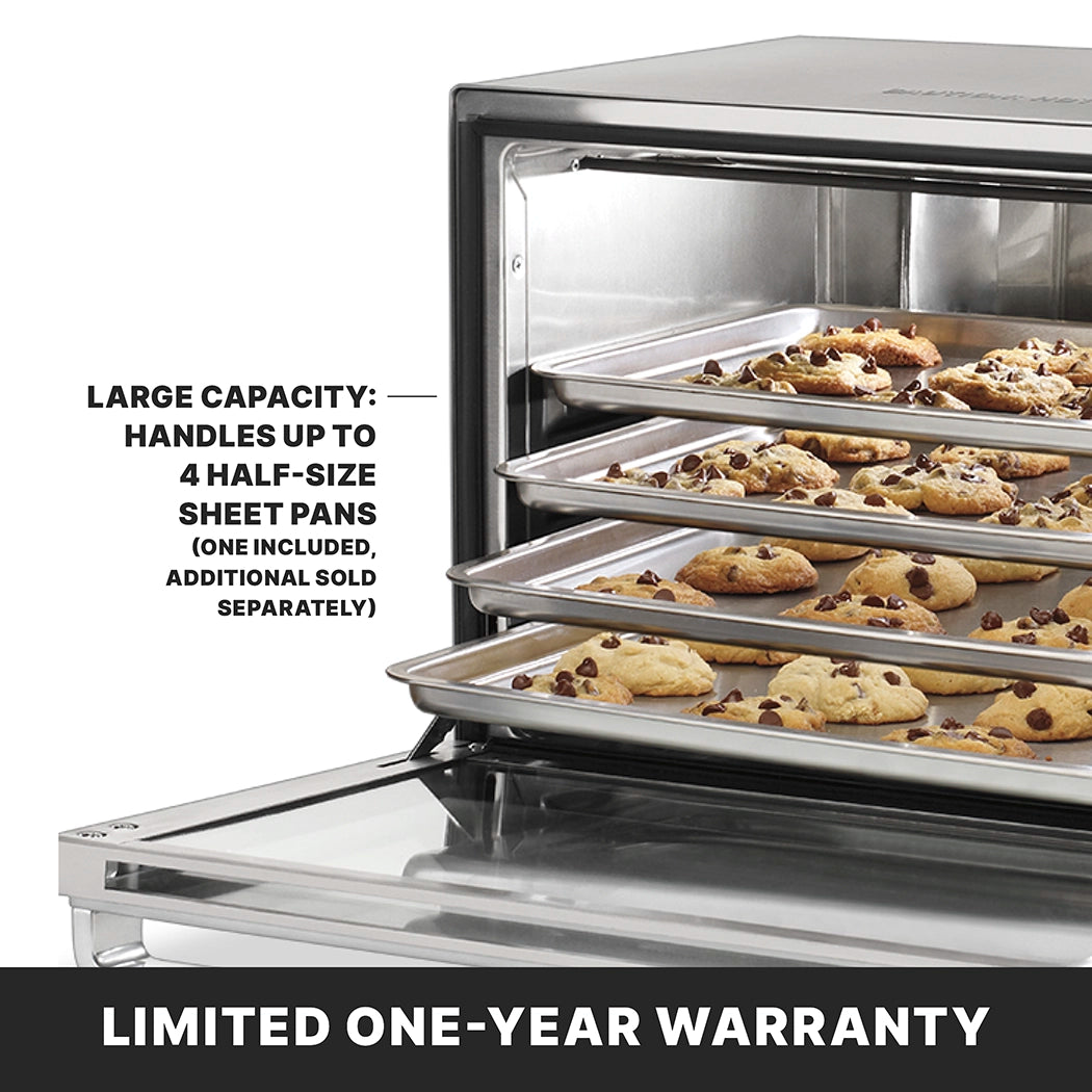 A stainless steel countertop convection oven with four racks, each holding a half-size sheet pan filled with chocolate chip cookies. Large capacity: handles up to 4 half-size sheet pans (one included, additional sold separately). Limited one-year warranty.