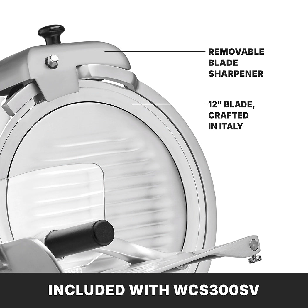 Close-up of a Commercial Food Slicer featuring a large 12" tempered chrome blade labeled Crafted in Italy. A removable blade sharpener is attached above. A bold caption below reads, INCLUDED WITH WCS300SV heavy duty slicer.