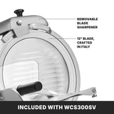 Close-up of a Commercial Food Slicer featuring a large 12" tempered chrome blade labeled Crafted in Italy. A removable blade sharpener is attached above. A bold caption below reads, INCLUDED WITH WCS300SV heavy duty slicer.
