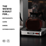 A glass coffee decanter filled with coffee sits on a stainless steel coffee warmer. To the left, text reads: THE WCW10 IS BUILT FOR... RESTAURANTS, CAFÉS, DINERS, CATERED EVENTS. Two certification logos are at the bottom.
