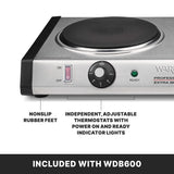 A close-up of a heavy-duty stainless steel electric hot plate shows a control knob, on/off switch, and indicator lights. Text points to nonslip rubber feet and mentions cast iron burner plates with independent, adjustable thermostats. “INCLUDED WITH WDB600” is below.