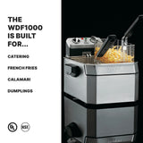 A Waring WDF1000 countertop electric fryer with a basket of French fries sits on a black surface. Text on the left reads “The WDF1000 Deep Fryer is built for... Catering, French Fries, Calamari, Dumplings.” UL and NSF certification logos are at the bottom.