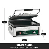 A stainless steel panini grill with a ribbed upper plate and flat lower surface is shown open. The front features a green control panel with knobs and switches. Dimensions are labeled: width 21.7, height 23, depth 20.7.
