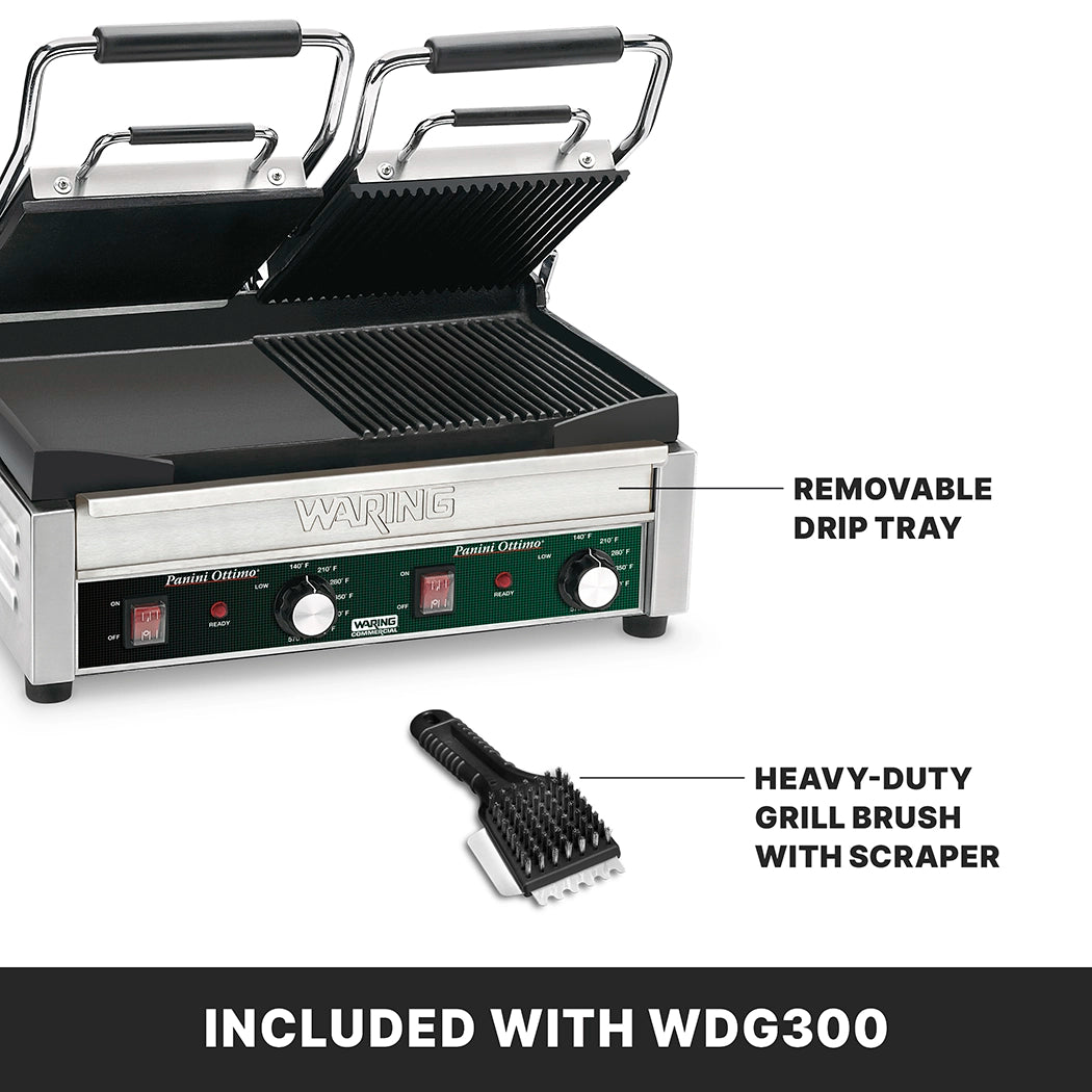 A stainless steel Commercial Panini Grill with two ridged plates is shown open. Labels point to its removable drip tray and a heavy-duty grill brush, both included with model WDG300. The front panel has switches and adjustable thermostats.