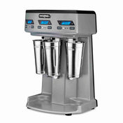 A silver, countertop Heavy Duty Drink Mixer featuring triple spindle action, three stainless steel cups, digital timers, and blue LED displays. The “Waring” branded machine has control buttons and stands on a broad base with a drip tray.