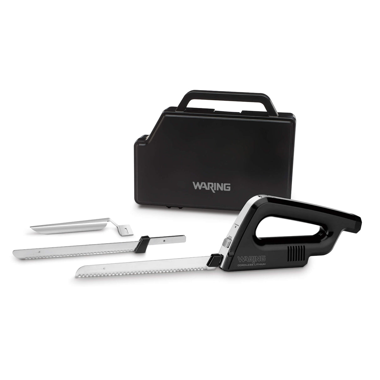 A black and silver electric carving knife set with two serrated blades, a carving fork, and a black carrying case labeled Waring. The knife handle and blades are arranged in front of the closed case on a white background.