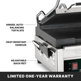 Close-up of a Compact Toasting Grill sandwich press with labels highlighting its hinged, auto-balancing top plate, heat-resistant handles, and adjustable back feet. Features durable cast iron plates and an “LIMITED ONE-YEAR WARRANTY” banner at the bottom.