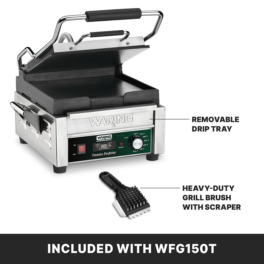 A Waring compact toasting grill with an open lid sits on a white background. Features are labeled: flat cast iron plates, a removable drip tray, and a heavy-duty grill brush with scraper. Text below reads, “Included with WFG150T.”.