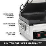 A close-up of a stainless steel dual toasting grill sandwich press with labeled features: hinged, auto-balancing top plate, adjustable thermostats, heat-resistant handles, and adjustable back feet. A red digital display is shown. Text reads, LIMITED ONE-YEAR WARRANTY.