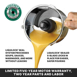 A hand pours yellow liquid from a batch bowl food processor, showcasing the tight-sealing black S-blade. Text highlights the LiquiLock Seal System, which prevents leaks, and promotes a five-year motor warranty with two-year parts and labor coverage.