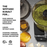 A commercial food processor with green sauce inside is shown on a countertop with lemon, garlic, oil, and metal container nearby. Text highlights the WFP14SC’s batch bowl for large-batch processing, chopping, puréeing, and more.