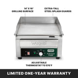 A Waring countertop electric griddle with a 14" x 16" cooking surface, extra-tall steel splash guards, and an adjustable thermostat up to 570°F. Text at the bottom notes a limited one-year warranty. The unit is shown from the front.