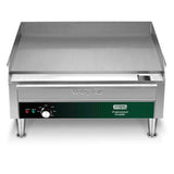 The Waring Countertop Electric Griddle features a 24" x 16" stainless steel cooking surface, raised back and side guards, control knob, indicator lights, and four short legs. The front panel displays the Waring logo and temperature settings.