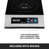 A black and silver Waring single hob induction cooktop with a flame graphic on the surface. The front panel features an LED display and easy-touch controls for power, timer, function, and on/off. Text highlights 10 power settings and a 3-hour timer.