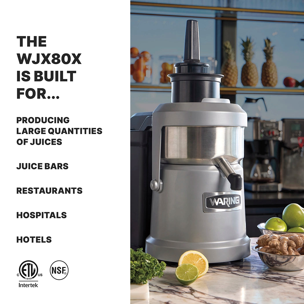 A silver Waring heavy duty Juice Extractor sits on a counter near apples, celery, and a lemon. Text reads: The WJX80X is built for continuous pulp ejection—ideal for producing large quantities of juices in juice bars, restaurants, hospitals, and hotels.