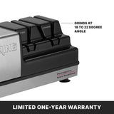 Close-up of an electric Knife Sharpener with labeled sharpening slots: “Fine” and “Coarse.” Text notes grinding wheels sharpen knives at an 18 to 22 degree angle. Bottom banner reads, “LIMITED ONE-YEAR WARRANTY.”.