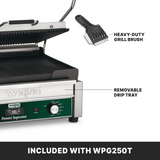 Close-up of a Waring Panini grill with open ribbed cast iron plates, showing a heavy-duty grill brush and removable drip tray. These included accessories are highlighted, with text below reading INCLUDED WITH WPG250T.