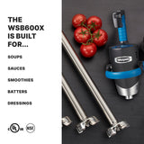 A Waring WSB600X heavy-duty immersion blender with a stainless steel shaft sits on a dark surface next to tomatoes. Text on the left lists uses: soups, sauces, smoothies, batters, dressings. Certifications (cULus, NSF) appear below.